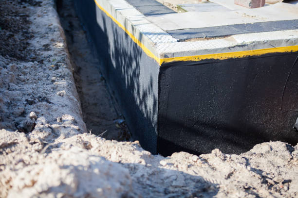 Professional Waterproofing technician working in Jericho, NY